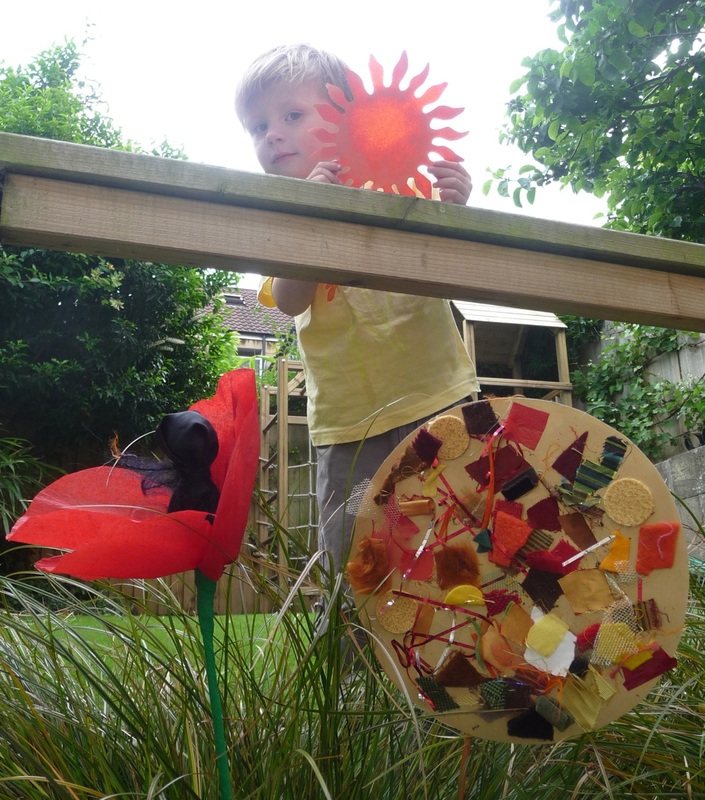 Summertime crafts: printed t-shirt, oily sun, collage sun and crepe paper poppy